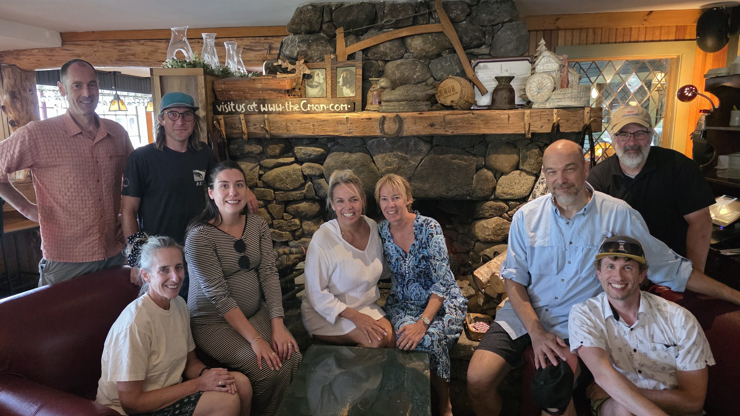 Boat Day 2026 Banwell staff in lounge with stone fireaplace