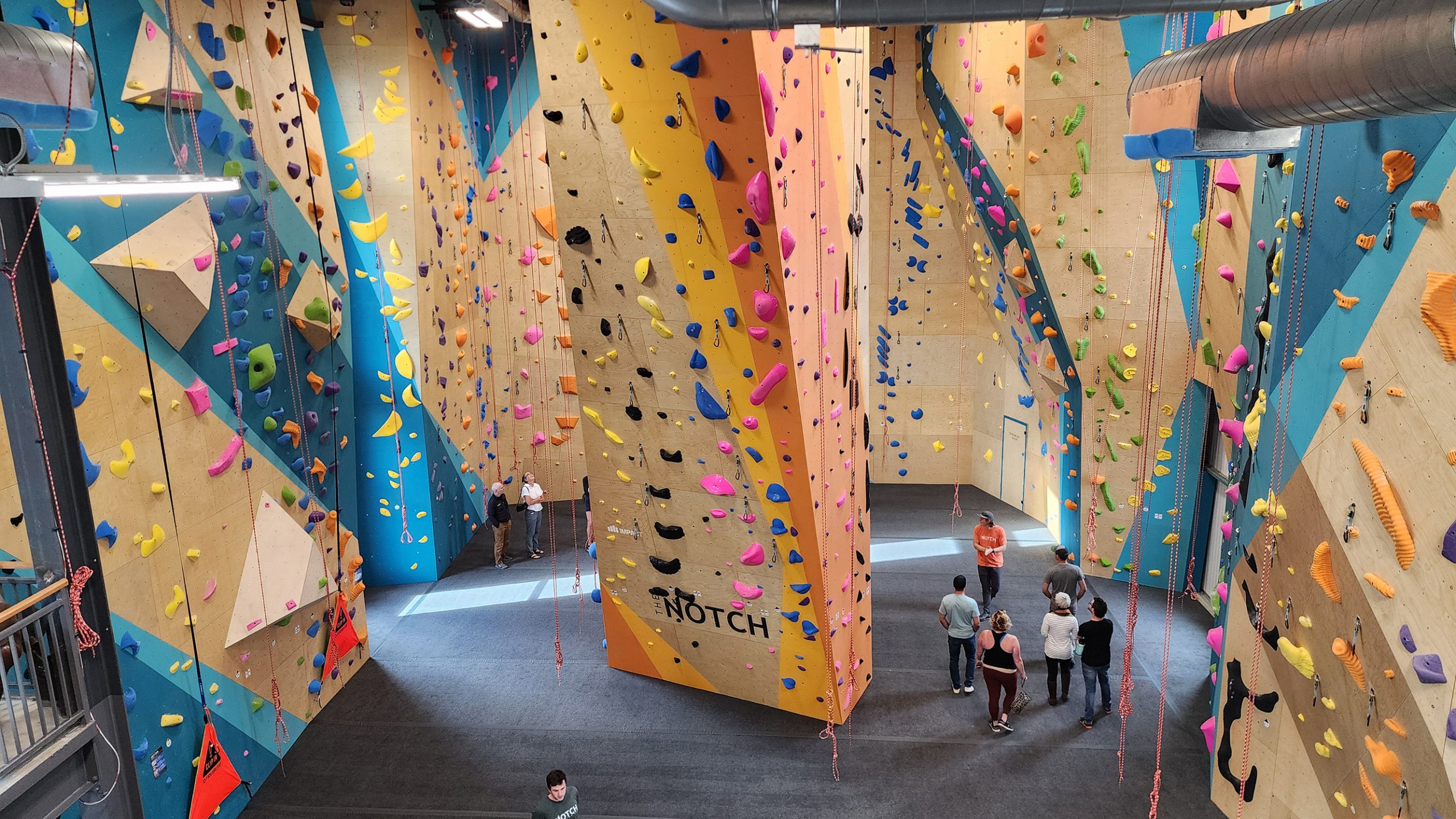 people inside a rock climbing facility